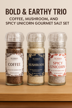 Load image into Gallery viewer, Three Summa Salts seasoning grinders — Coffee, Mushroom, and Spicy Unicorn — lined up on a neutral background, showcasing their labels and textures.
